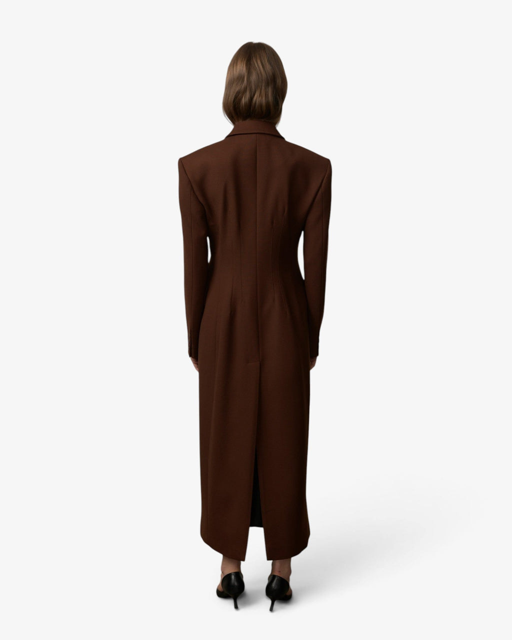 Model wearing a She Stories Herskind Java Brown fitted wool-blend long coat with structured shoulders and lapels.