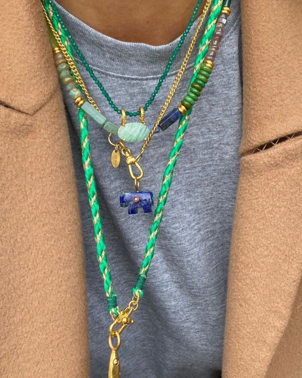 She Stories I am Jai delicate necklace featuring small green onyx gemstones on an 18k gold-plated brass chain.