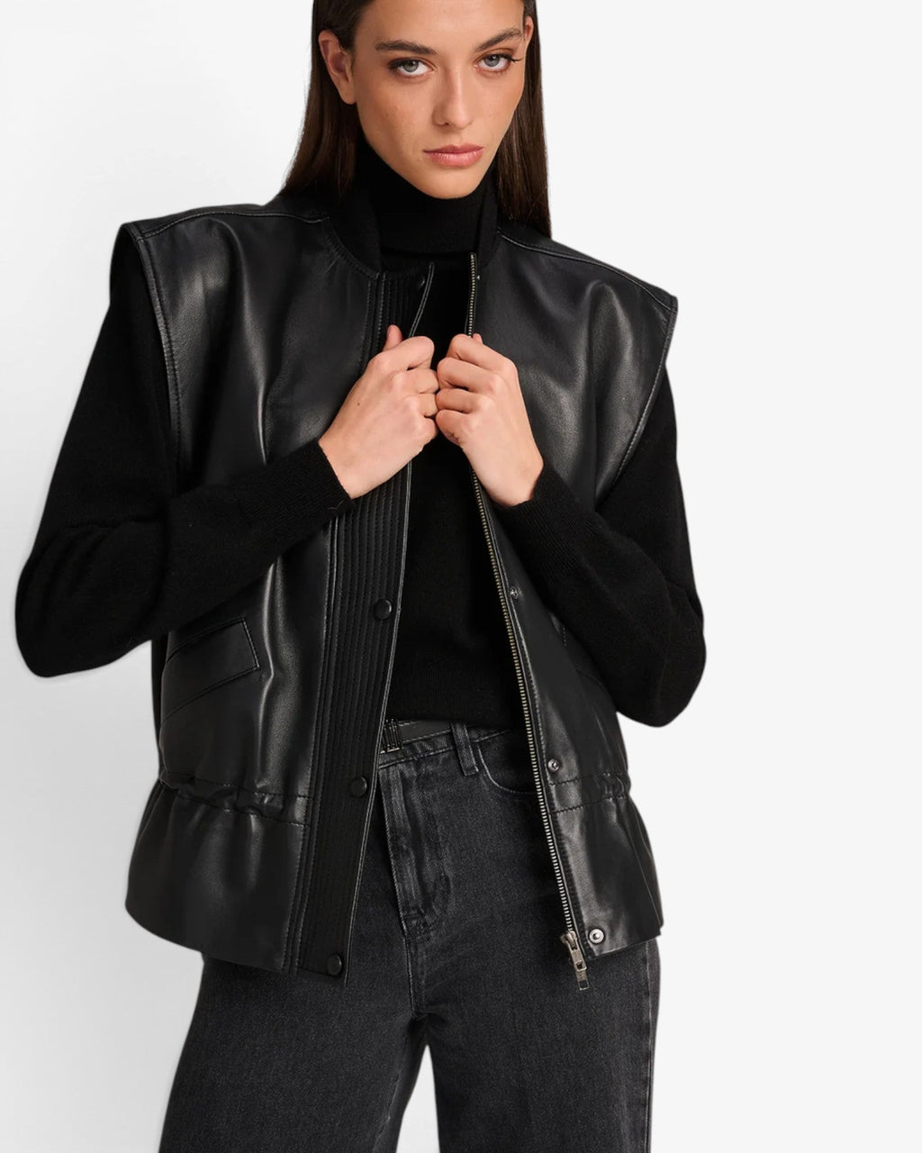 She Stories March23 Antwerp black leather gilet with a snap button front and cinched waist detail.
