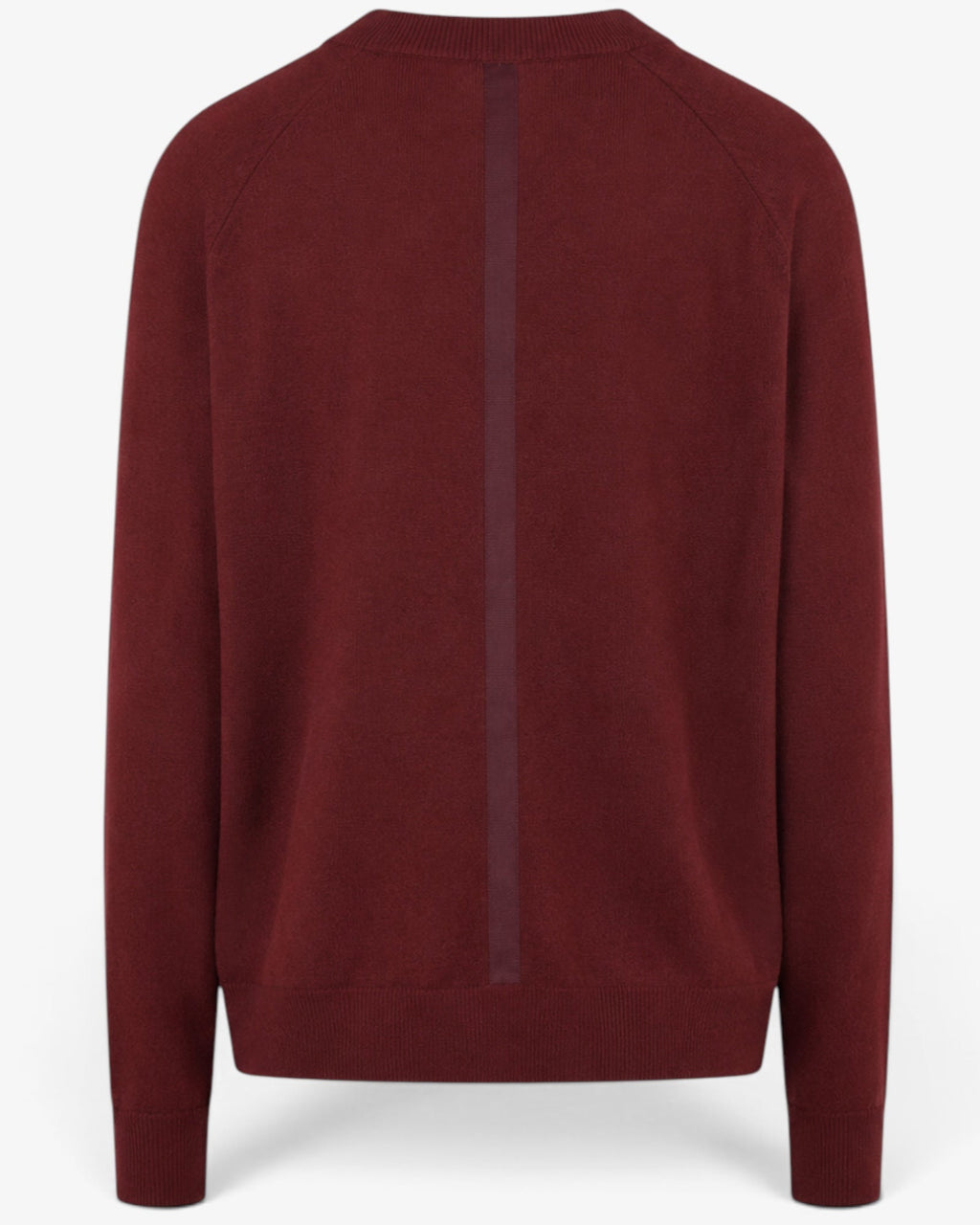 She Stories March23 Palermo rust-colored knit sweater with a round neckline and long sleeves.